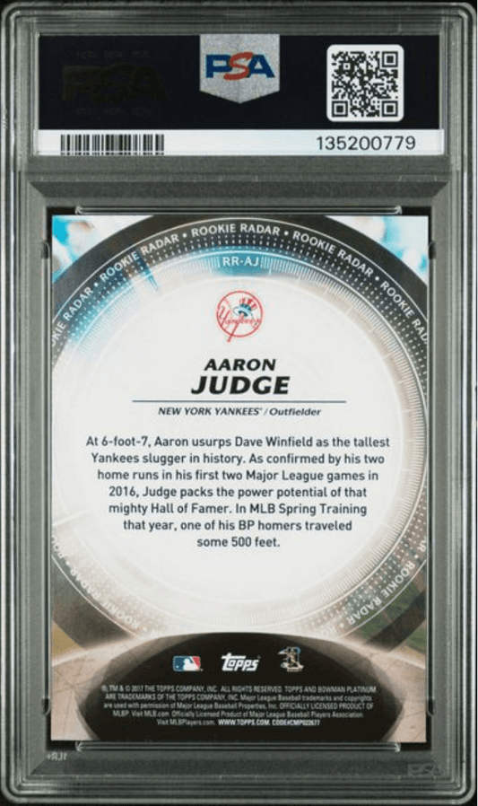 Back of PSA-graded 2017 Topps Bowman Platinum Aaron Judge rookie card showing player bio text on white circular background with gray border.