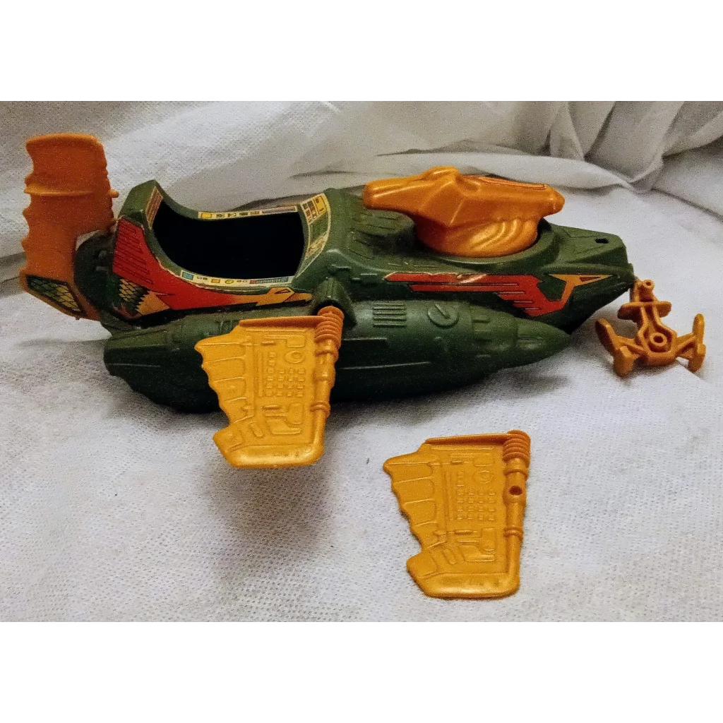 Green and orange Wind Raider universe vehicle toy with yellow wings