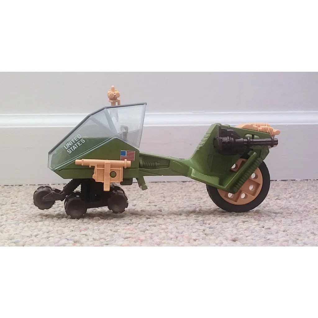 Green GI Joe vehicle recon sled toy with US flag and clear windshield