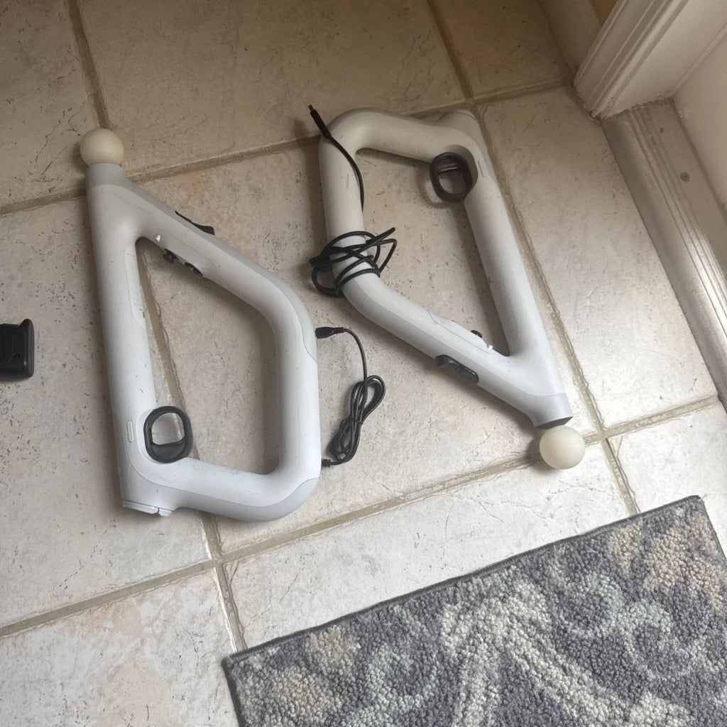 White PlayStation VR2 motion controllers with matte bodies and spherical caps in 2-set bundle