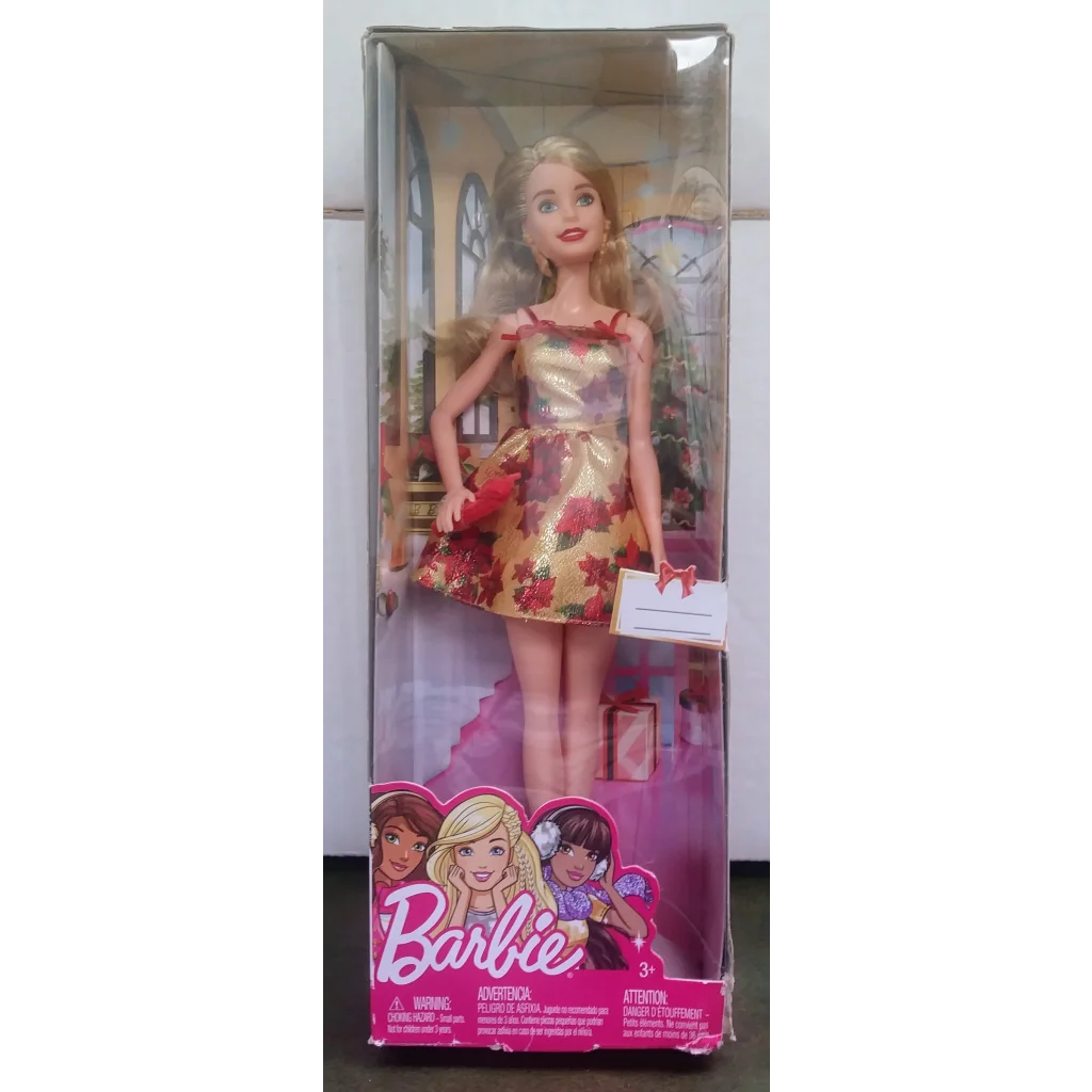 Holiday Barbie doll with blonde hair in gold red floral dress