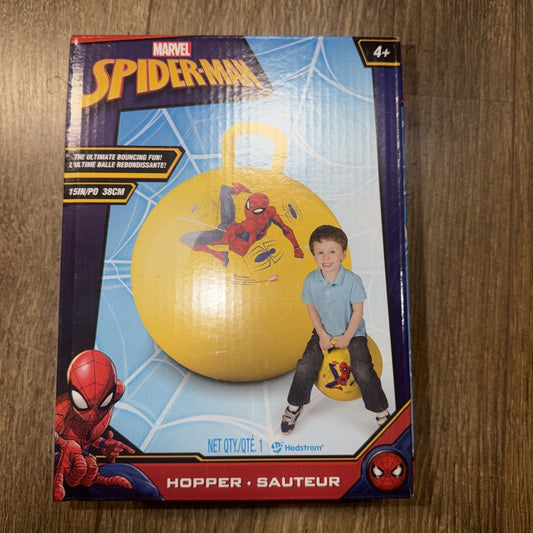 Front of Marvel Spider-Man hopper ball package showing yellow ball with Spider-Man graphic and child demonstrating use on wooden floor background.