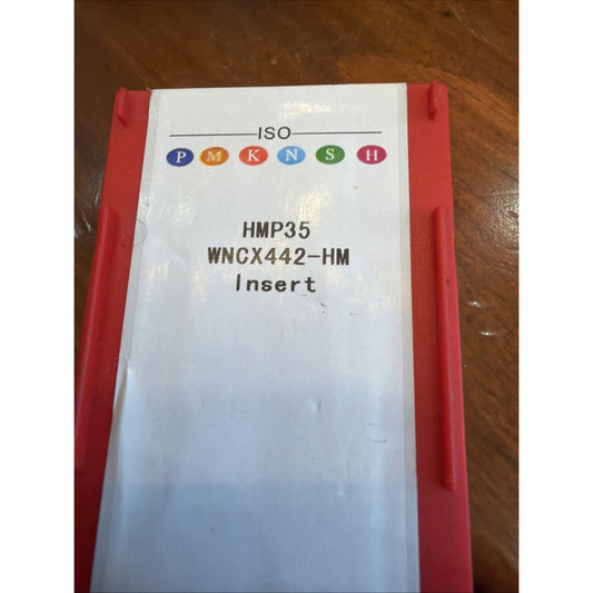 White cardstock insert with ISO PMKNSH logo and HMP35 WNCX442-HM text, held in red foam packaging.