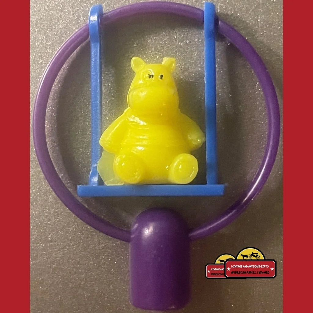 Yellow bear figurine on blue swing in purple frame from Vintage Assorted Pencil Toppers