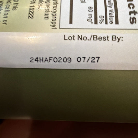 Close-up of product label showing lot number 24HAF0209 and best-by date 07/27 printed on white background.
