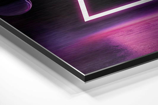 Angled close-up view of layered Dibond wall art with purple and pink neon lighting, white border accent, and brushed aluminum edges visible.