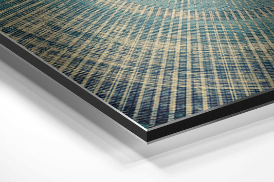 Angled perspective view of teal and cream striped textile pattern on brushed aluminum dibond panel with black and silver edges.