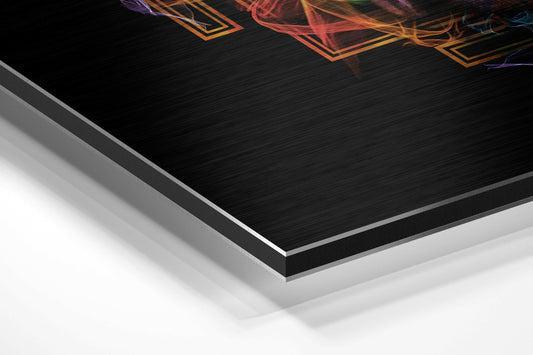 Close-up angled view showing layered materials of neon mandala Buddha head on black brushed aluminum dibond with white backing sheets.