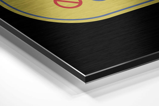 Close-up angled view of layered aluminum dibond construction showing yellow brushed surface with red circular neon design and blue border edge.