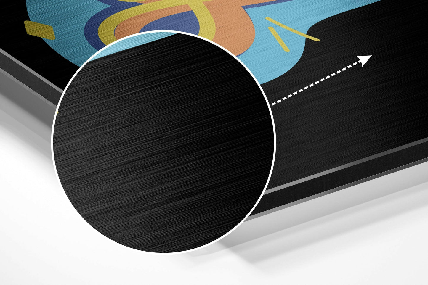 3D perspective view of brushed black aluminium circle with white border against geometric blue, orange, and yellow abstract background design.
