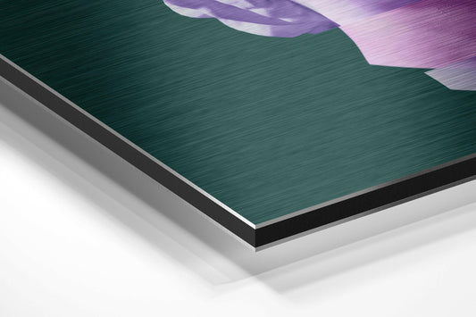 Angled product shot showing layered edge construction of teal brushed aluminum dibond with purple and pink gradient artwork visible at top.