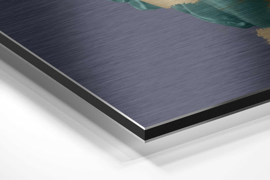 Close-up angled view of layered Dibond panel showing brushed aluminum surface with black and white backing layers.