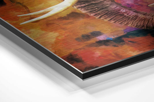 Close-up angled view of brushed aluminum dibond edge showing layered material construction with colorful elephant artwork visible on surface.