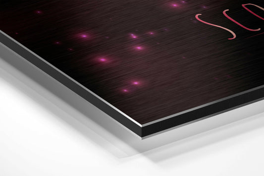 Angled perspective view of brushed aluminum wall art with dark textured surface, pink glowing lights, and coral red Scorpio symbol in upper right corner.