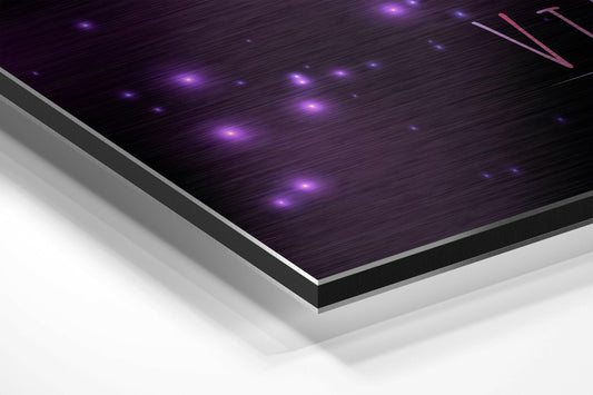 Close-up angled view of brushed aluminium panel with purple LED lights and pink triangular Virgo symbol against dark textured surface.