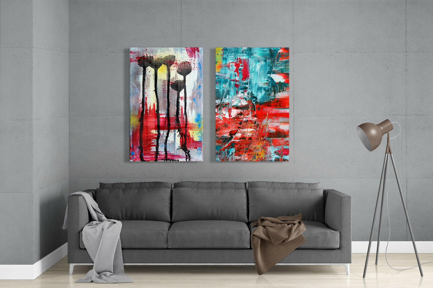 Two colorful abstract glass art panels with red, turquoise, and yellow brushstrokes hanging above a gray sofa in a modern living room.