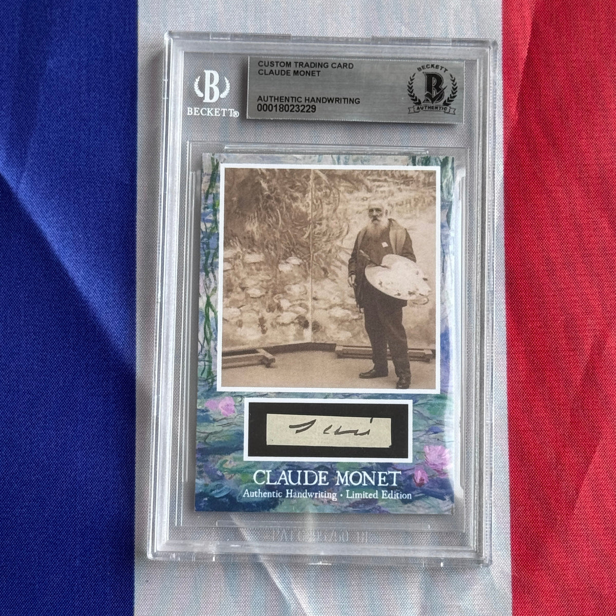 Front view of a Beckett-encased card: sepia photo of a bearded man with a palette, and a black-framed handwritten signature below.