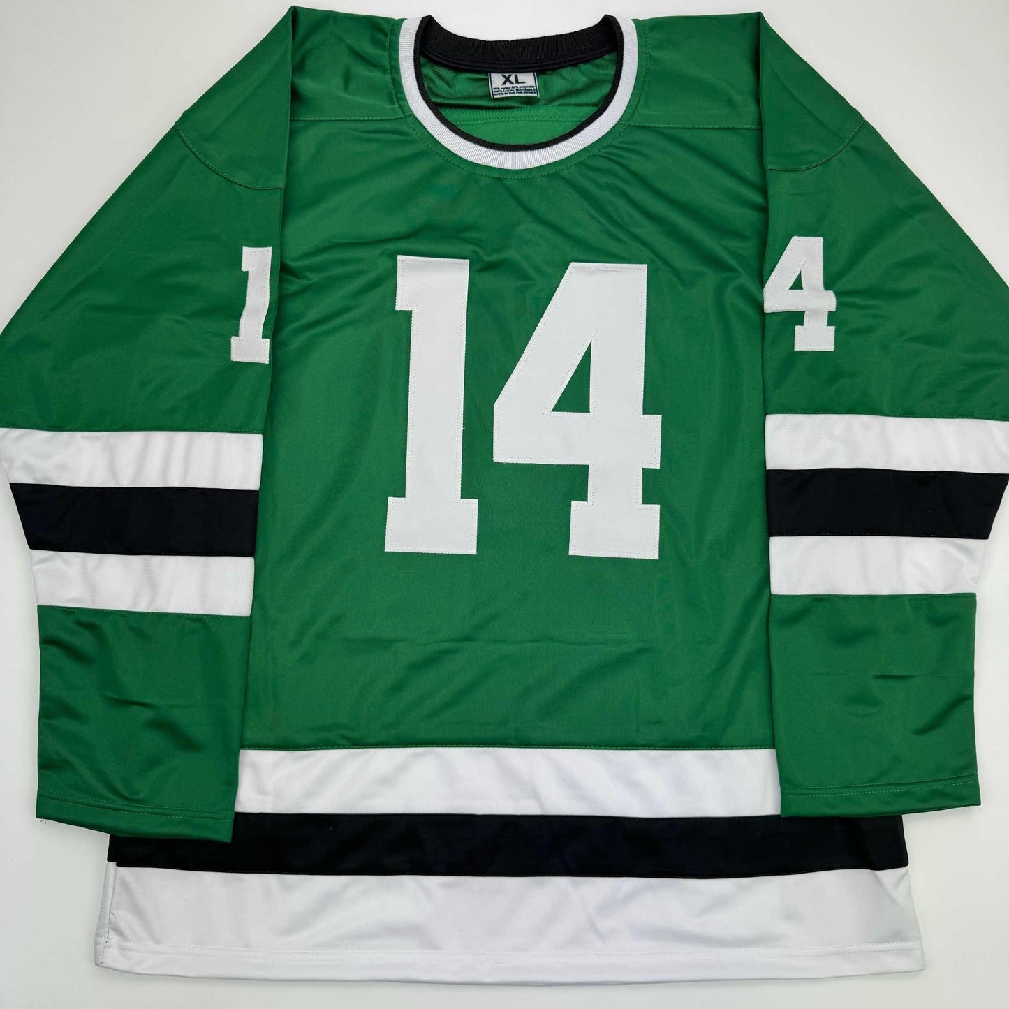 Green hockey jersey with white number 14 displayed flat against white background, showing front view with black and white striped sleeves.