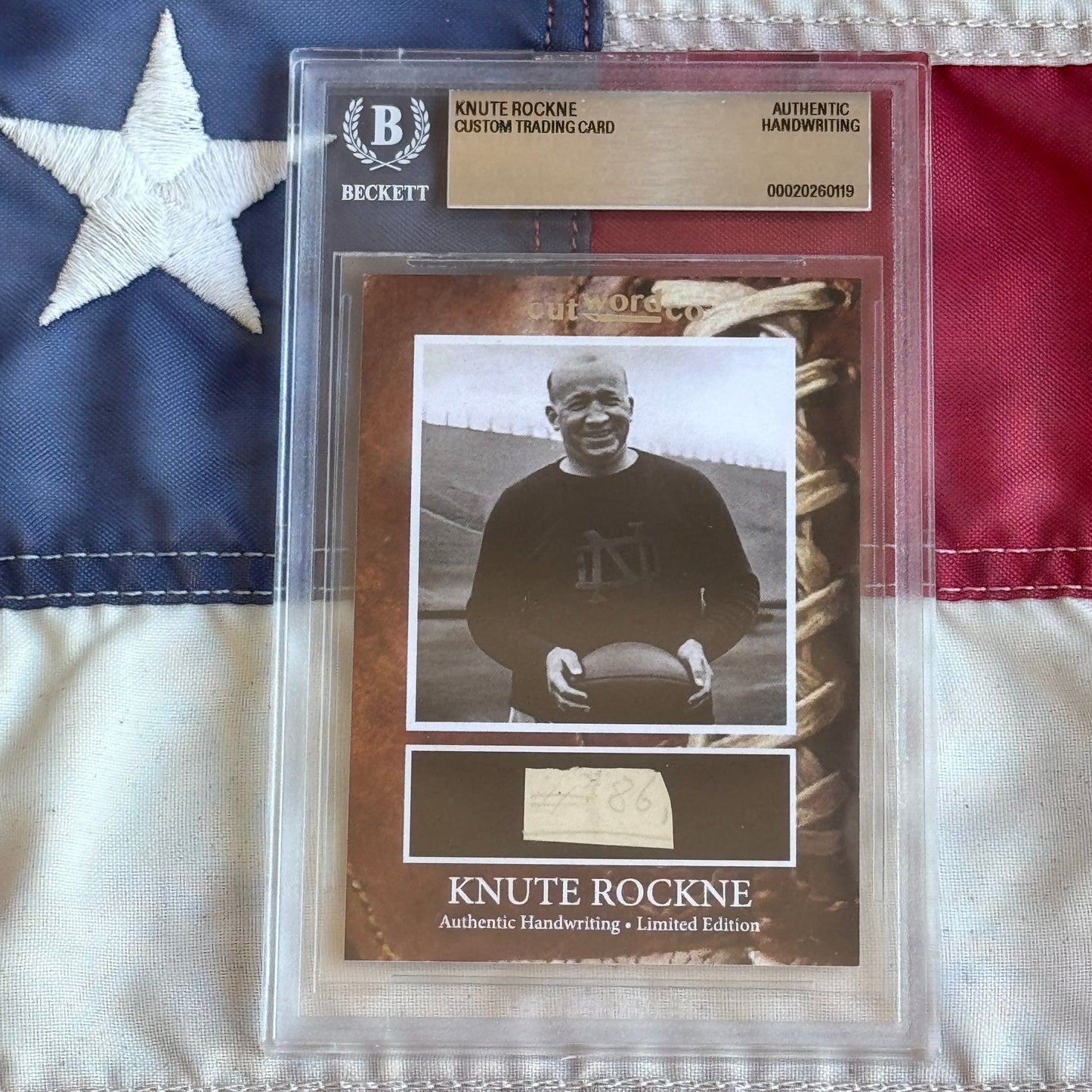 Knute Rockne Beckett Encapsulated Handwriting Removed from his Notre Dame Textbook Signed