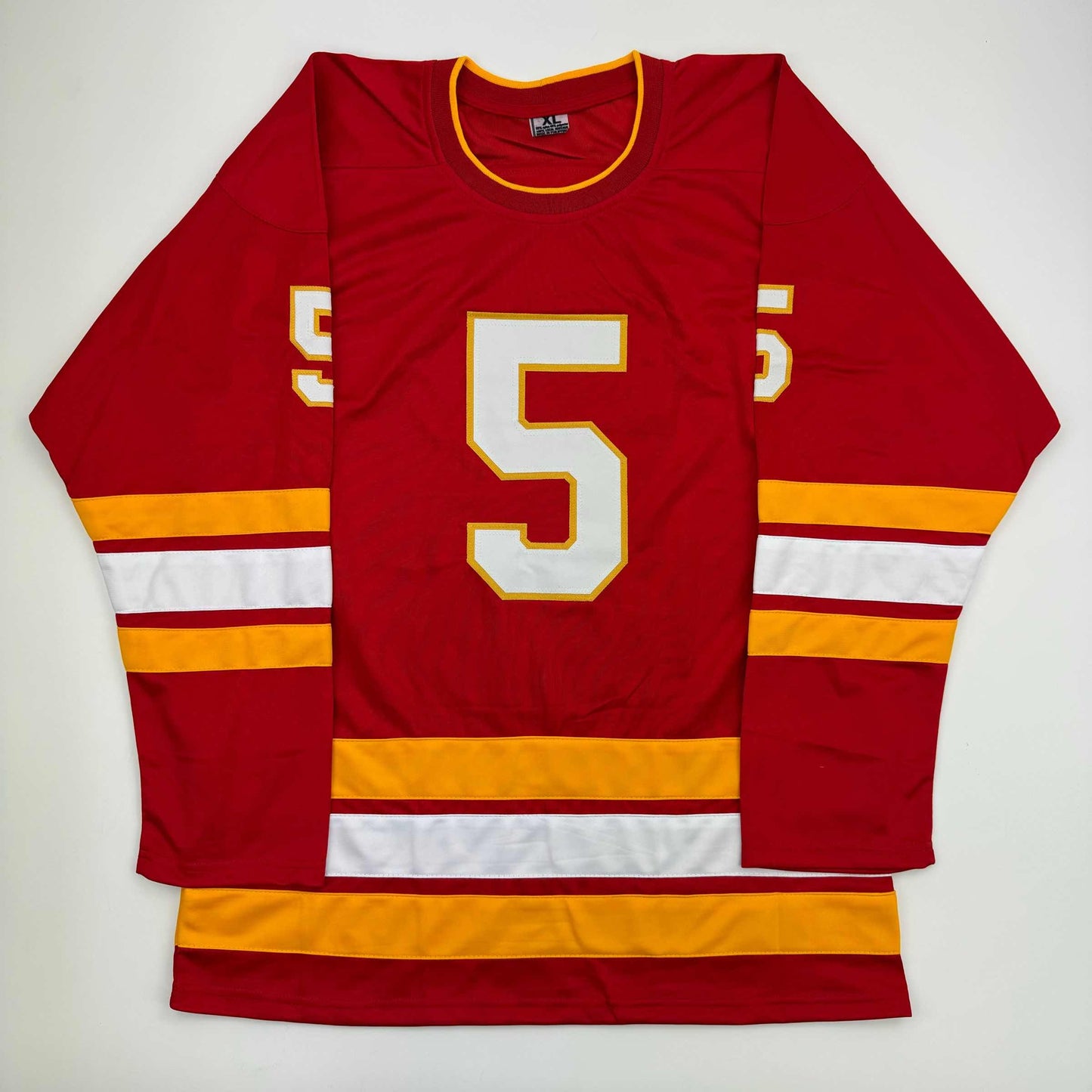 Red hockey jersey with white number 5 and gold/yellow trim, displayed flat against white background, front view.