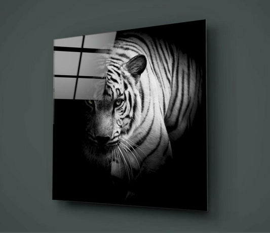 Black and white glass wall art displaying a tiger's head in profile against a dark background, mounted on a gray wall.