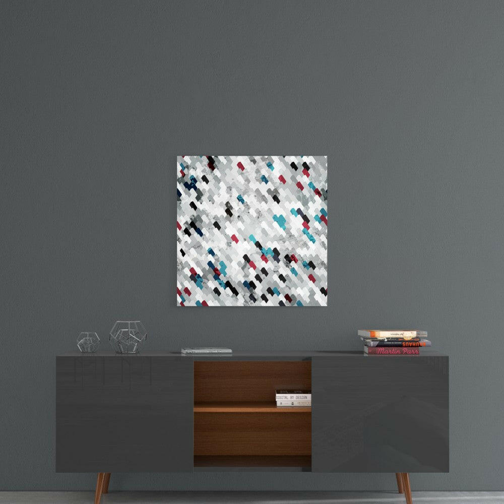 Modern mid-century console displaying abstract glass wall art with white, gray, red, and teal diamond pattern above.