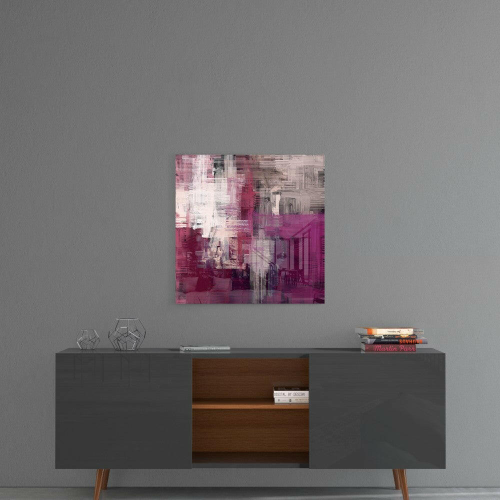 Purple Touch glass wall art hanging above a mid-century modern credenza with geometric decor and stacked books.