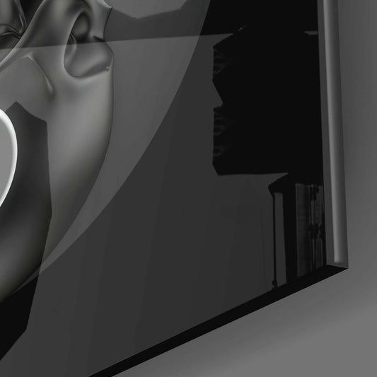 Close-up detail of white sculptural headphone portion against dark background showing glass wall art construction.