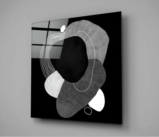 Black glass wall art displaying abstract geometric shapes in grayscale with white line details against dark background.