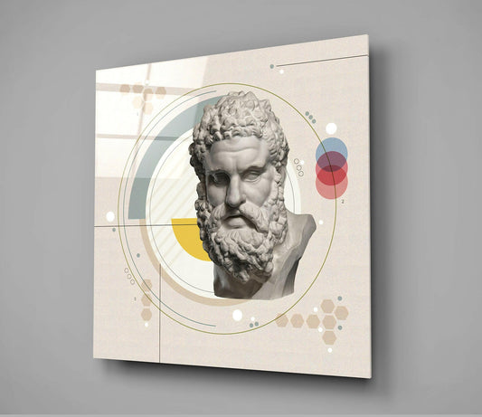 Angled front view of glass wall art featuring a classical bearded bust surrounded by geometric circles, lines, and colored shapes in yellow, blue, and red on cream background.