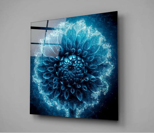 Frosted blue dahlia glass wall art mounted on gray wall, showing three-dimensional flower with crystalline sparkle effect and dark horizontal lines across surface.