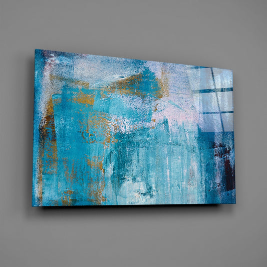 Angled front view of turquoise and gold textured abstract glass wall art with layered brushstrokes and geometric grid pattern on gray background.