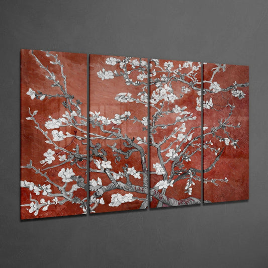 Four-panel glass wall art displaying white flowering branches on terracotta red background, angled perspective view against gray wall.