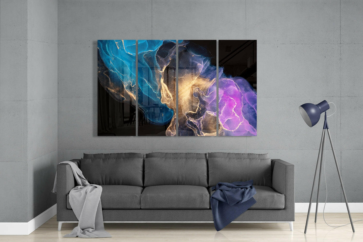 Four-panel glass wall art displaying blue, gold, and purple lightning bolts installed above gray sofa in modern living room.