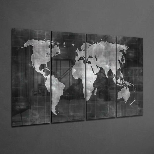 Four-panel black framed glass wall art displaying a silver metallic world map on dark textured background, angled perspective view.