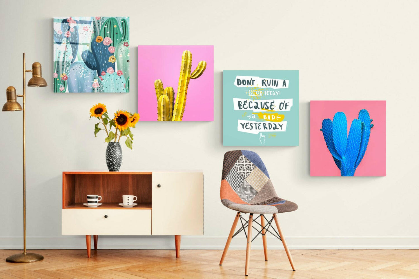 Styled interior scene displaying four cactus-themed glass wall artworks in pink, turquoise, and multicolor on cream wall above mid-century furniture.