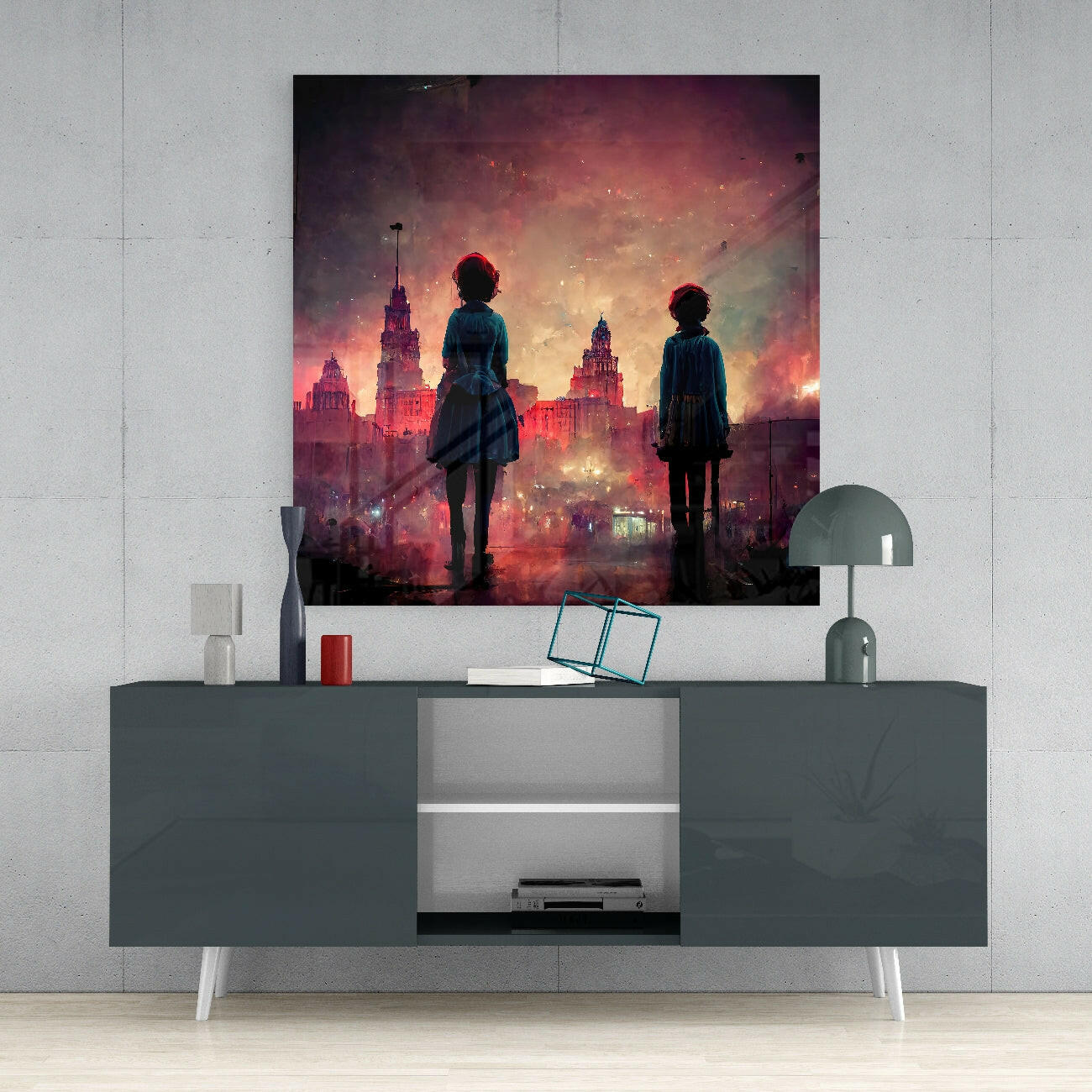 Glass wall art depicting two silhouetted figures overlooking a crimson-lit cityscape with ornate buildings, displayed above a gray media console.