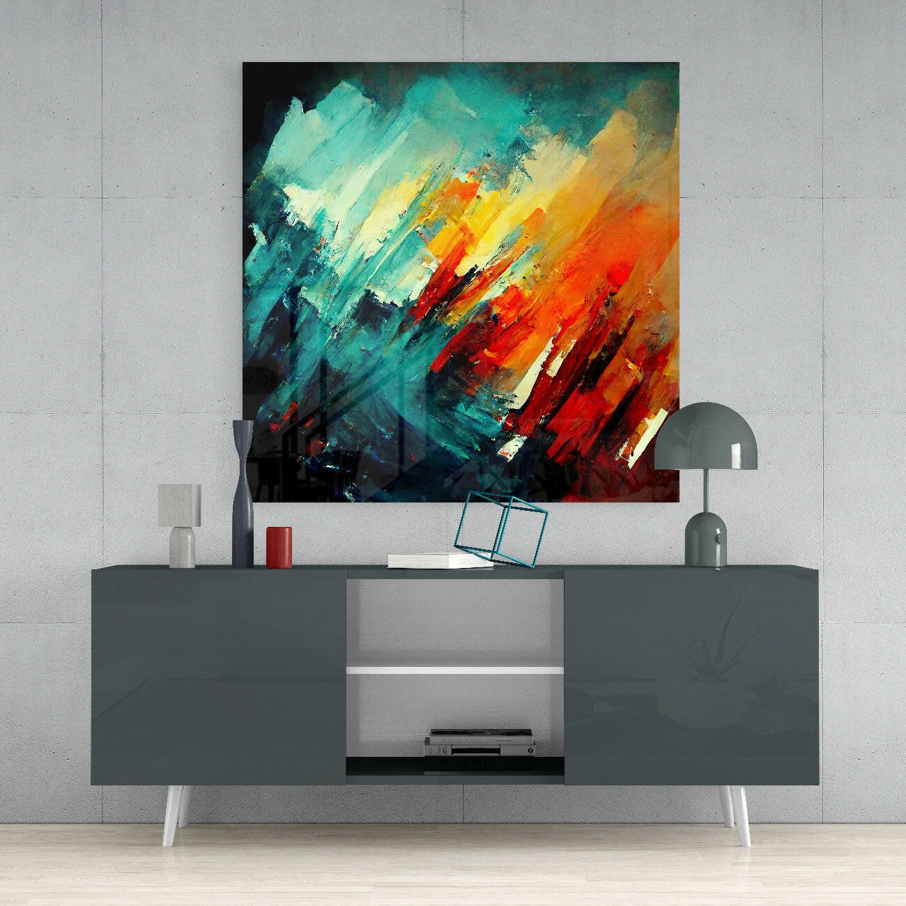 Abstract brush stroke glass wall art in turquoise, yellow, orange and red displayed above gray media console in modern interior.