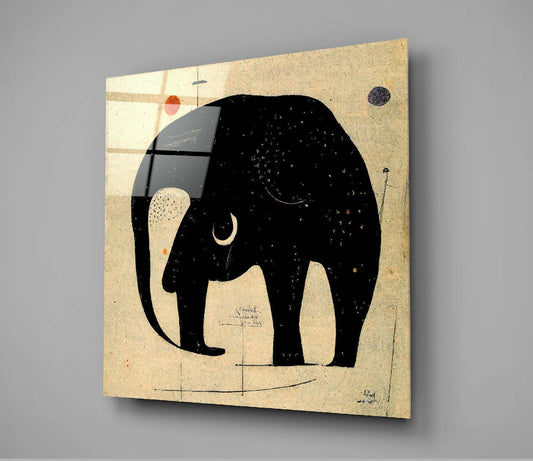 Black silhouette elephant with crescent moon eye on beige textured glass panel displayed at angle against gray wall.