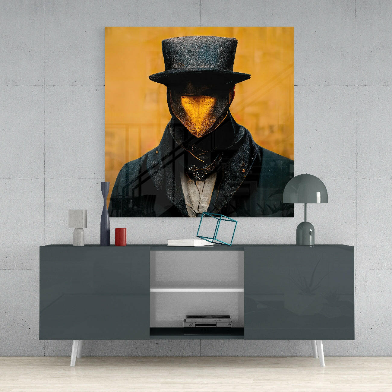 Glass wall art depicting a figure in a top hat with a golden glowing face against a yellow background, displayed above a gray console table.