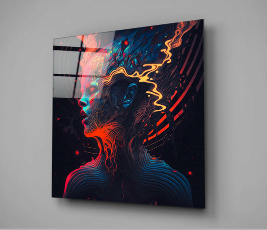 Angled view of glass wall art displaying a neon-lit profile head with red, blue, and yellow swirling patterns against a dark background, mounted on gray wall.