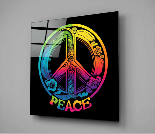 Angled view of glass wall art displaying a colorful rainbow peace symbol with floral details and "PEACE" text on black background.