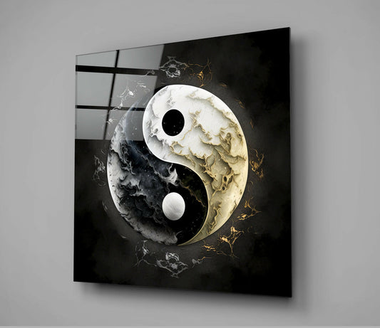Angled three-quarter view of black and white marbled yin-yang glass wall art with gold accents against gray background.