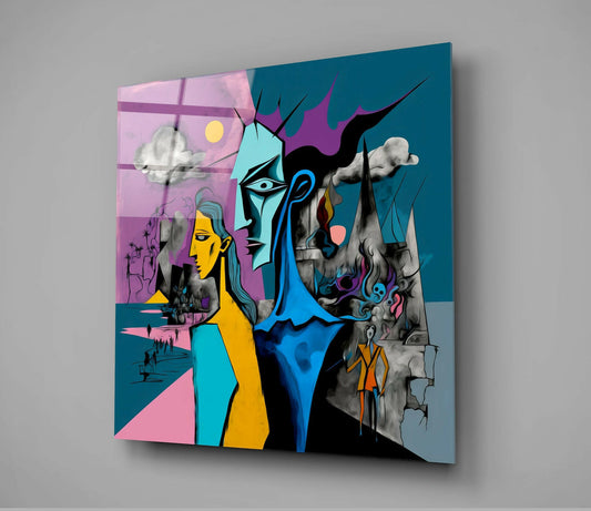 Angled view of a glass wall art panel displaying colorful cubist faces in yellow, blue, cyan, and black against teal and pink backgrounds with white cloud elements.