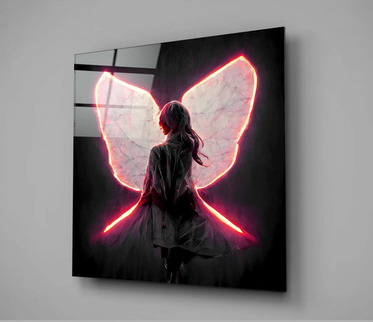 Glass wall art panel displaying a figure from behind with glowing neon pink and yellow butterfly wings against dark background.