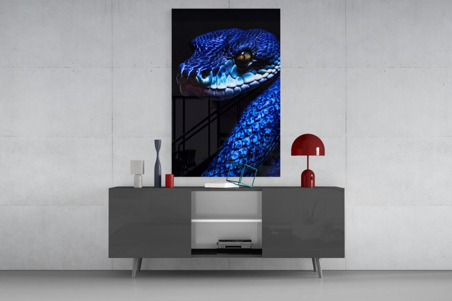 Blue viper glass wall art displayed above gray media console in modern living room setting with red accents.