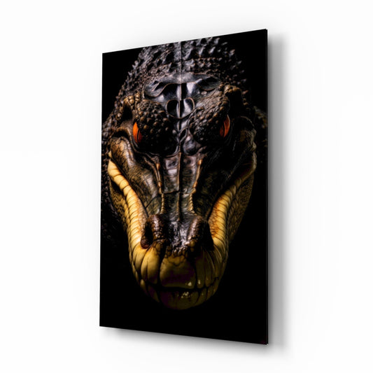 Close-up frontal view of a crocodile's head with textured gray-brown scales, golden-yellow throat, and red-orange eyes against black background on mounted glass panel.