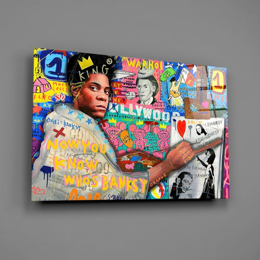 Angled perspective of colorful pop art canvas featuring portrait with crown, graffiti text, and mixed media collage elements including black and white photographs.