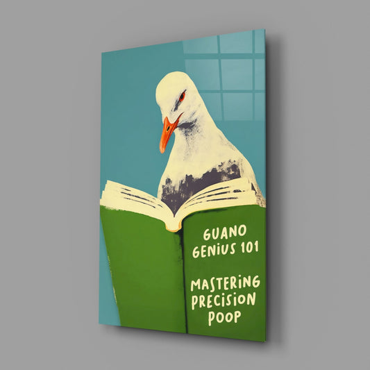 Glass wall art panel at angle showing white seagull reading green book titled "Guano Genius 101: Mastering Precision Poop" against turquoise background.
