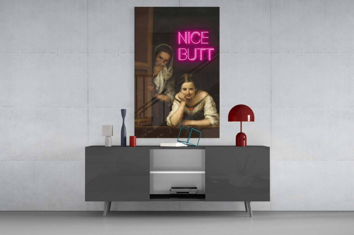 Modern living room display featuring classical painting with pink neon "NICE BUTT" text on gray media console.